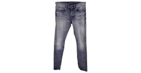 Vaqueros de mezclilla desgastados de corte slim de Saint Laurent en algodón azul 